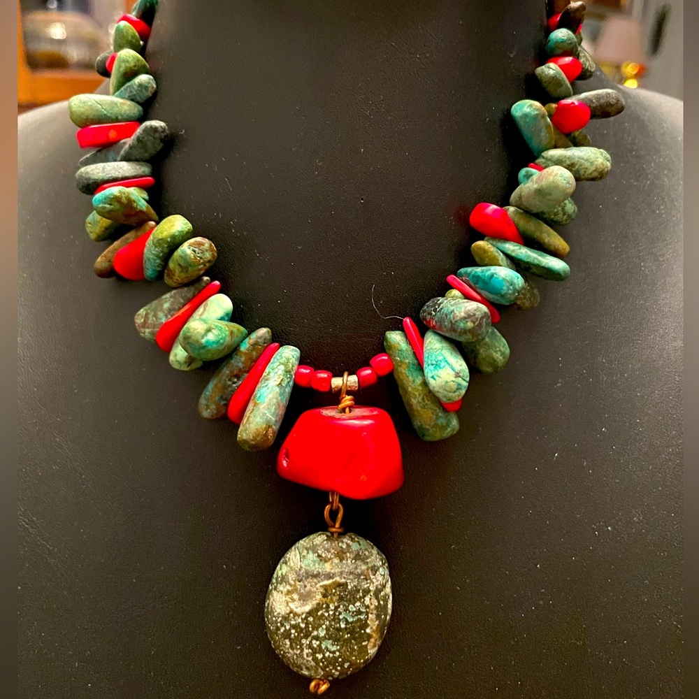 Turquoise and coral stones - hand crafted into this beautiful piece. Length @15”